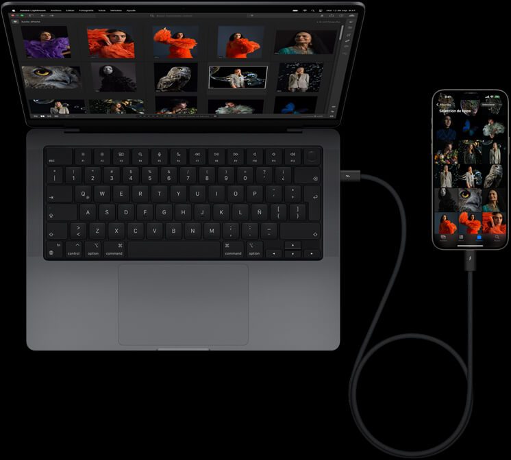 Un iPhone 15 Pro Max conectado a una MacBook Pro de 14 pulgadas con USB-C